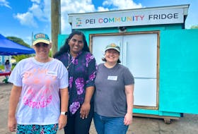 Colleen VanIderstine, left, a volunteer for the P.E.I. Community Fridge, joins Sandra Sunil, co-ordinator of the initiative, and volunteer Heidi Haering to celebrate its second anniversary. Thinh Nguyen • The Guardian