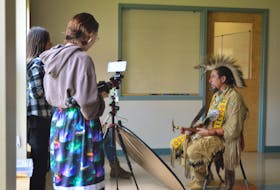Jonas Bernard and Adora Johnson film an interview with Membertou Heritage Centre general manager Jeff Ward for a PSA they are producing this week at Artist Inside Multimedia Camp. MITCHELL FERGUSON/CAPE BRETON POST