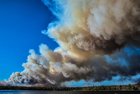 Thick smoke billowed from a wildfire in Barrington, N.S., on May 27. The fire was in the Barrington Lake area and burned out of control for weeks. FRANKIE CROWELL PHOTO