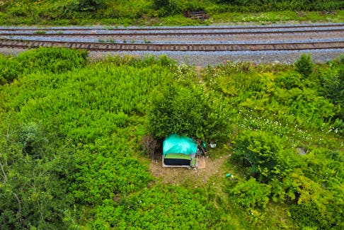 FOR NEWS OR FILE:
A tent structure belonging to a person experiencing homelessness, is seen next to a set of railtracks along the Dartmouth waterfront Tuesday August 8, 2023.

TIM KROCHAK PHOTO