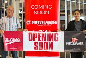 Franchisee Craig Boudreau and manager Rooban Randhawa stand in front of the location where a joint Pretzelmaker and Mrs. Fields store will serve shoppers at the Mayflower Mall. Boudreau hopes the store will open before Black Friday in November. Chris Connors/Cape Breton Post