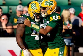 The Edmonton Elks' Kevin Brown (4) and quarterback Tre Ford (2) celebrate a touchdown against the Calgary Stampeders during CFL action at Commonwealth Stadium, in Edmonton Saturday Sept. 9, 2023.