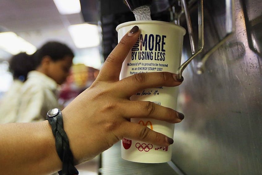 A customer fills a 21 ounce cup with soda at a 'McDonalds' on September 13, 2012 in New York City.