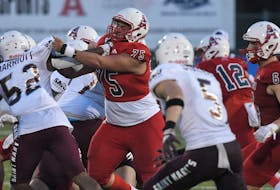 Acadia offensive lineman Khalid Soliman battles against the Saint Mary's Huskies during an Atlantic university football game last Friday evening at Raymond Field in Wolfville. - ACADIA ATHLETICS 