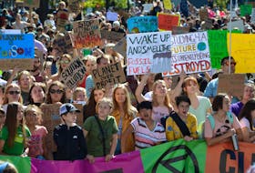 Thousands, many with signs in hand, piled into Grand Parade for the climate strike in Halifax on Friday, Sept. 27, 2019.