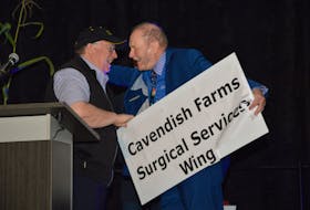 Cavendish Farms president Robert Irving, left, and Warren Ellis celebrate after announcing that the Prince County Hospital's surgical wing will be renamed the Cavendish Farms Surgical Services Wing. The announcement came on the heels of a $500,000 donation from Cavendish Farms to the Prince County Hospital Foundation during the Grass Roots and Cowboy Boots fundraiser at Credit Union Place in Summerside on Saturday, Sept. 9. Kyle Reid