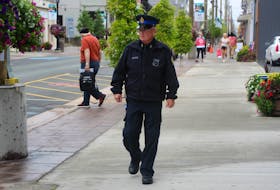 Cape Breton Regional Police Const. Gary Fraser walks along Charlotte Street on Thursday. With word that the police service will be adding an extra resource to patrol the downtown core within the next week or so, Fraser — who helped bring together a downtown business watch program — says he has noticed a change in mood and atmosphere in the downtown core since the spring. The identity of the new downtown patrol officer has yet to be revealed. IAN NATHANSON/CAPE BRETON POST