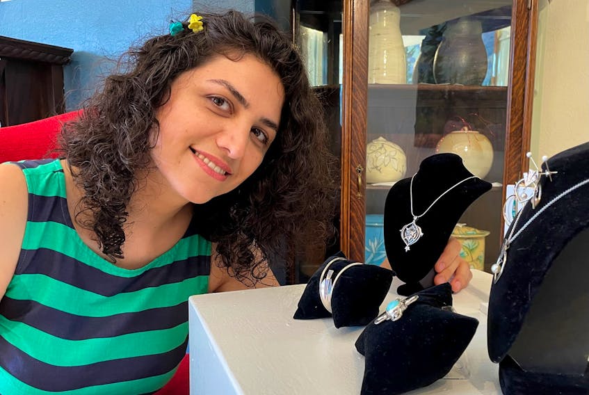 Iranian jewelry maker Shagayegh Radmehr displays some of her sterling silver creations at Gallery 78 in Fredericton, the oldest private art gallery in New Brunswick.