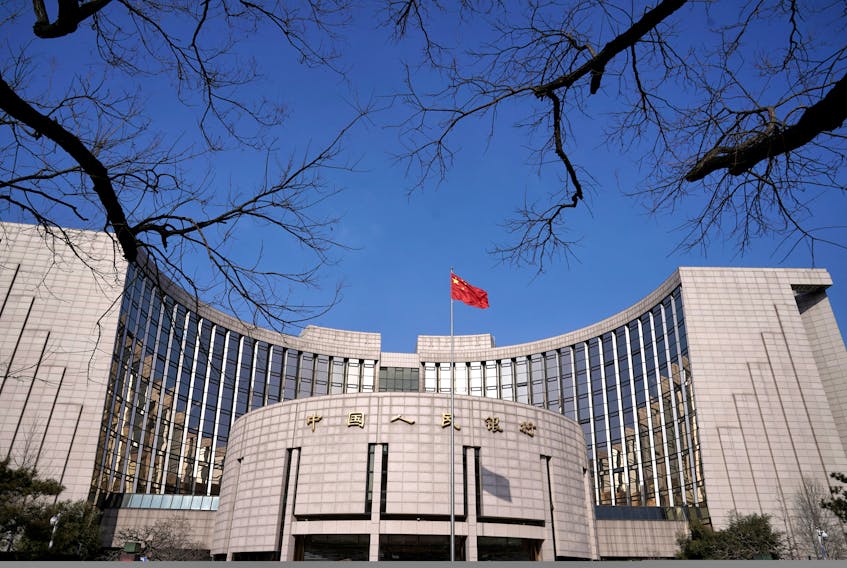 SHANGHAI/SINGAPORE (Reuters) - China's central bank rolled over maturing medium-term policy loans while keeping the interest rate unchanged on Friday, focusing on boosting liquidity on top of a