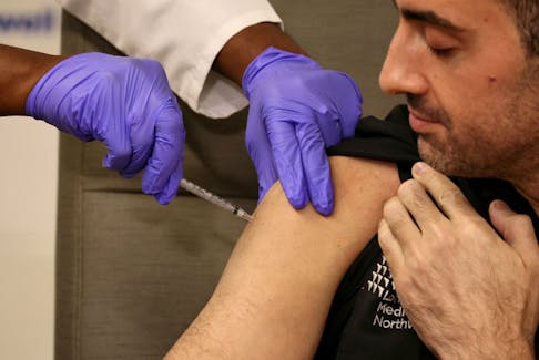 By Ahmed Aboulenein and Jason Lange WASHINGTON (Reuters) - About half of Americans are interested in getting an updated COVID-19 vaccine more than three years after the virus infected millions and