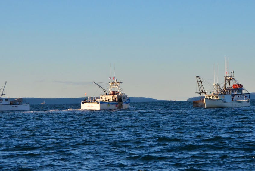 Dozens of commercial boats have been hauling up and disabling what they call illegal traps set outside of a season established for commercial purposes. (AARON BESWICK PHOTO)