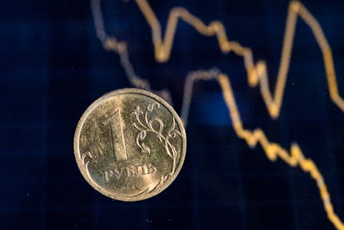 By Alexander Marrow (Reuters) - The Russian rouble strengthened sharply on Friday ahead of an interest rate decision by the central bank that could see the cost of borrowing rise again to help shore