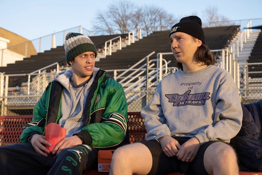  Pete Davidson and Paul Dano in a scene from Dumb Money.