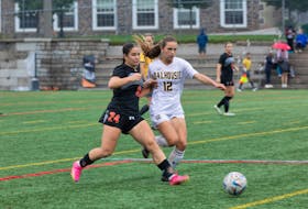Leah Disipio of the Cape Breton Capers, left, works her way around Chloe Richardson of the Dalhousie Tigers during Atlantic University Sport women’s soccer action at Wickwire Field in Halifax on Friday. Disipio scored three times and led the Capers to a 4-0 victory. CONTRIBUTED/MILANA PADDOCK, DALHOUSIE ATHLETICS