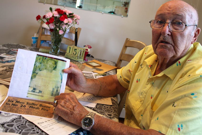 Robert Green holds a newspaper clipping and photo of him after surviving a blast in the No. 26 Colliery in Glace Bay on Sept. 18, 1973. The 50th anniversary of the incident is on Monday, an important date for many of the miners who worked at No. 26. “Nobody knows what the miners went through," he said.