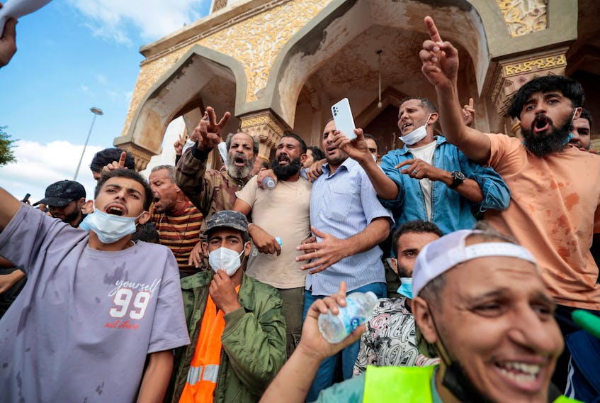 DERNA, Libya (Reuters) - Hundreds of people protested in the eastern Libyan city of Derna on Wednesday, venting anger against authorities and demanding accountability one week after a flood killed