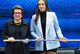 Minnesota's Taylor Heise (right) from the NCAA poses with former American tennis player Billie Jean King after being selected first overall during the first round of the inaugural Professional Women’s Hockey League draft in Toronto on Sept. 18, 2023.