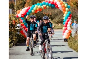 Cara Beals (right) at the 2022 BMO Ride for Cancer. Cara, who passed away from neuroendocrine cancer in June 2023, was a long-time BMO Ride participant; her friends and loved ones now fundraise in her honour. PHOTO CREDIT: Uncharted
