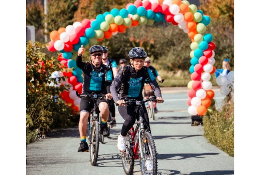 Cara Beals (right) at the 2022 BMO Ride for Cancer. Cara, who passed away from neuroendocrine cancer in June 2023, was a long-time BMO Ride participant; her friends and loved ones now fundraise in her honour. PHOTO CREDIT: Uncharted