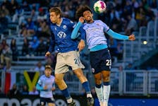 Halifax Wanderers striker Jordan Perruzza, left, and Atletico Ottawa's Tyr Duhaney-Walker go up for a header during Monday's CPL game at the Wanderers Grounds. - Halifax Wanderers