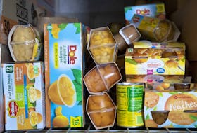 Fruit cups are stacked on a shelf at the Serving Our Kids Foundation warehouse in Henderson, Nev., on Saturday, Sept. 12, 2020. Banning plastics from grocery stores could have unforeseen repercussions on food security, Dr. Sylvain Charlebois writes.
