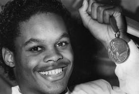 Halifax boxer Ray Downey was all smiles at a Halifax news conference as he displayed the bronze medal he won at the Seoul Olympics. Oct. 5, 1988 â€“ WW/Harvey