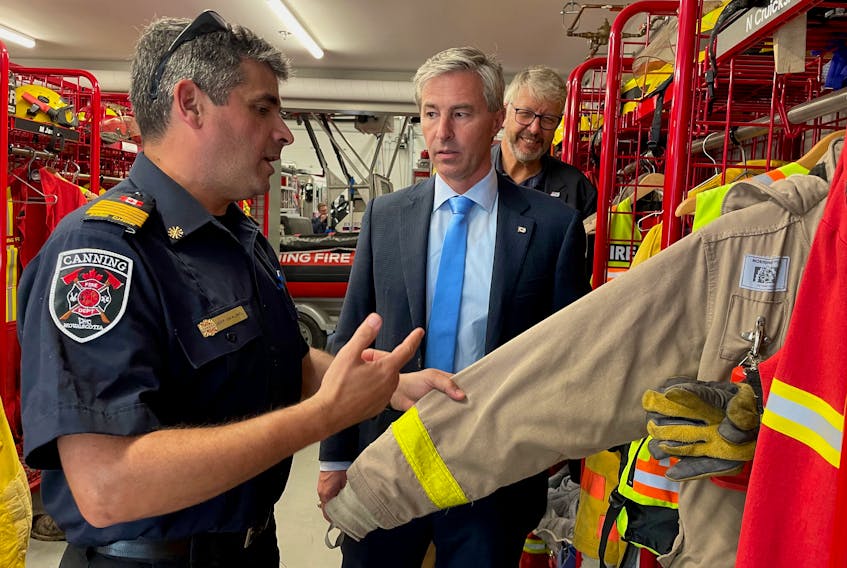 Canning Volunteer Fire Department Chief Jeff Skaling, left, shows Premier Tim Houston, centre, and John Lohr, the minister responsible for the Office of Emergency Management, some of its bunker gear on Sept. 19. The province announced almost $1.5 million was being invested in 80 organizations through the Emergency Services Provider Fund this year.
Jason Malloy
