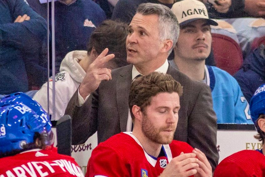 Canadiens head coach Martin St. Louis behind the bench at the Bell Centre during a Habs game in March.