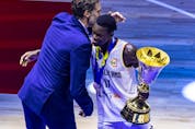  Dennis Schroder #17 of Germany receives the Naismith Trophy from Pau Gasol during the FIBA Basketball World Cup Final between Germany and Serbia on September 10, 2023 in Manila, Philippines. (Photo by Ezra Acayan/Getty Images)