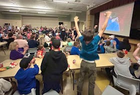 A packed cafeteria celebrates Oceanview Education Centre teachers winning the main portion of Tuesday night's "Family Feud Canada" appearance. IAN NATHANSON/CAPE BRETON POST