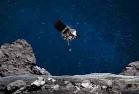 An artist's rendering of the OSIRIS-REx spacecraft descending towards asteroid Bennu to collect a sample of the surface. It's due back on Earth on Sunday.