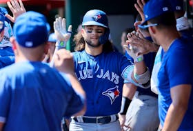 Bo Bichette #11 of the Toronto Blue Jays celebrates with teammates after hitting a home run against the Cincinnati Reds at Great American Ball Park on August 20, 2023