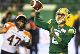 Edmonton Elks quarterback Tre Ford (2) throws against the B.C. Lions in Edmonton on Oct. 21, 2022.