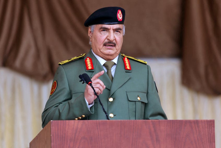 (Reuters) - After Derna's catastrophic floods, eastern Libyan military leader Khalifa Haftar flew in by helicopter and received salutes from his troops as he toured the city where thousands of people