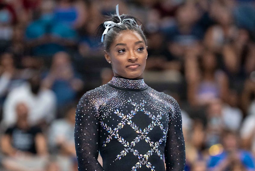 (Reuters) - Simone Biles is set to compete in her sixth world championships this month after posting the top all-around score at a U.S. qualifying competition, USA Gymnastics said on Wednesday. Biles,