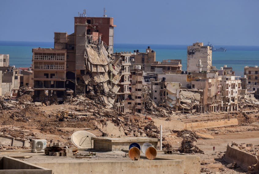 By Ahmed Elumami, Abdelhadi Ramadi and Maya Gebeily DERNA/BENGHAZI (Reuters) - The small first-floor apartment in Derna became home away from home to Syrian migrant Ammar Kanaan, after the risk of