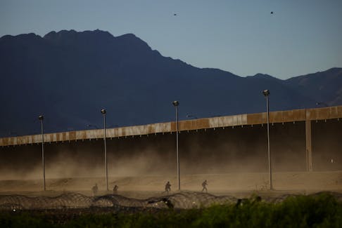 By Lizbeth Diaz and Daina Beth Solomon TIJUANA (Reuters) - Thousands of migrants have crossed into the United States in recent days, from California to Texas, with many more still arriving by bus and