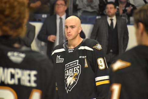 Cape Breton Eagles forward Jacob Newcombe stands with his teammates during a pre-game ceremony prior to the team's home opener at Centre 200 in Sydney on Friday. Newcombe was diagnosed with non-Hodgkin’s lymphoma during the off-season and is undergoing treatment. JEREMY FRASER/CAPE BRETON POST.