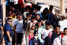 By Crispian Balmer ROME (Reuters) - Asylum seekers in Italy will have to pay 4,938 euros ($5,259) to avoid detention while their request for protection is being processed, the government said on