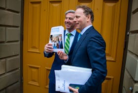 Premier Tim Houston and Finance Minister Allan MacMaster pose with a copy of the provincial budget outside Province House in Halifax on Thursday, March 23, 2023.
Ryan Taplin - The Chronicle Herald