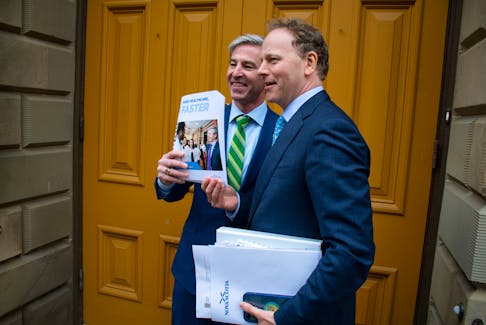 Premier Tim Houston and Finance Minister Allan MacMaster pose with a copy of the provincial budget outside Province House in Halifax on Thursday, March 23, 2023.
Ryan Taplin - The Chronicle Herald