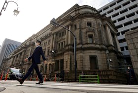 TOKYO (Reuters) - The Bank of Japan maintained ultra-low interest rates on Friday and its dovish guidance on future monetary policy, signalling it is in no rush to phase out its massive monetary