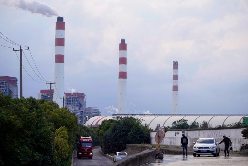 By David Stanway SINGAPORE (Reuters) - The complete phasing-out of fossil fuels is not realistic, China's top climate official said, adding that these climate-warming fuels must continue to play a