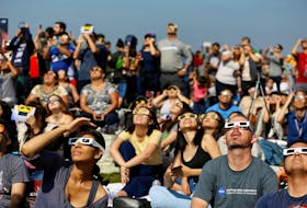 By Will Dunham WASHINGTON (Reuters) - Millions of people in the Americas will be in a position to witness an astronomical treat on Oct. 14 with a solar eclipse in which - weather permitting - the moon