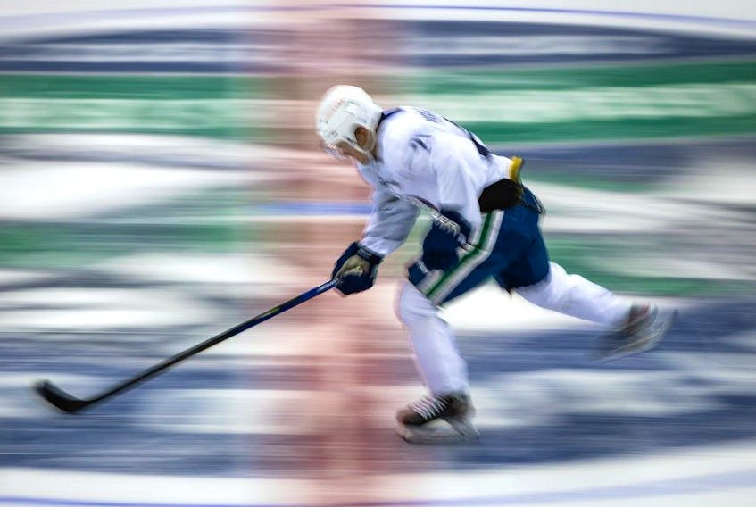 Vancouver Canucks' Nils Hoglander of Sweden skates during the NHL team's training camp in Abbotsford on Sept. 23, 2021.