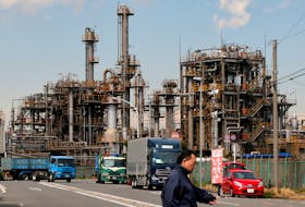 TOKYO (Reuters) - Japan's factory activity contracted for the fourth straight month and the service sector growth slipped to an eight-month low, a survey showed on Friday, highlighting the challenges