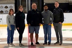 The Charlottetown Islanders’ front office staff poses at centre ice of Eastlink Centre, home of the Quebec Major Junior Hockey League team. From left: Anna Friedrich – administration co-ordinator; Katie Ramsay – director of accounting and administration; Jason MacLean – vice-president of sales, and Cody Cudmore – director of marketing and communications.