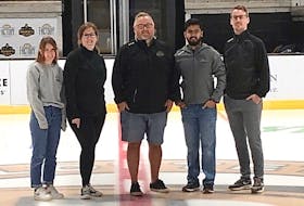 The Charlottetown Islanders’ front office staff poses at centre ice of Eastlink Centre, home of the Quebec Major Junior Hockey League team. From left: Anna Friedrich – administration co-ordinator; Katie Ramsay – director of accounting and administration; Jason MacLean – vice-president of sales, Akshat Kaushal – director of financial planning and analysis, and Cody Cudmore – director of marketing and communications.