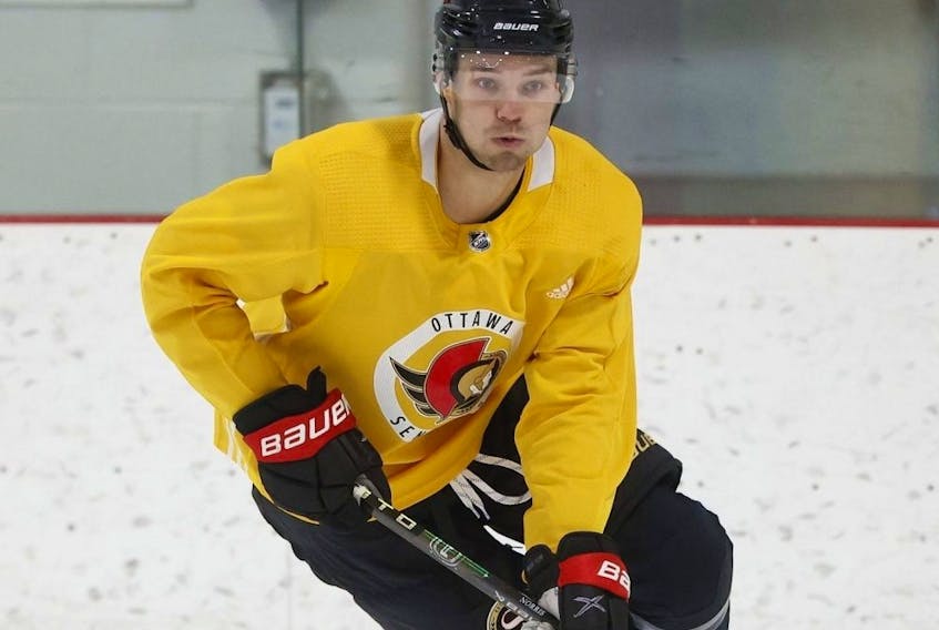 Ottawa Senators forward Josh Norris wears a yellow non-contact jersey during the first day of training camp on Sept. 21, 2023.