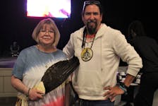 Yvonne Meunier-Paul, left, did the opening prayer before the National Indigenous Peoples Day feast at Membertou Trade and Convention Centre.  Her son Jeff Ward, right,  was the guest speaker. NICOLE SULLIVAN/CAPE BRETON POST